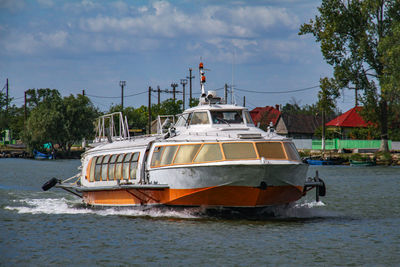 Boat sailing on sea against sky