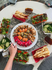 High angle view of person preparing food on table