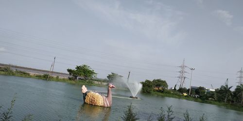 Scenic view of river against sky