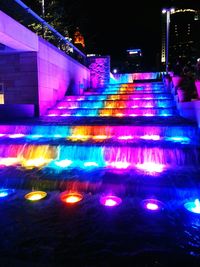 Illuminated fountain at night