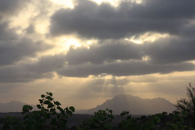 Scenic view of landscape against sky at sunset