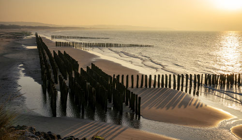 Old wave breakers on wissant beach .