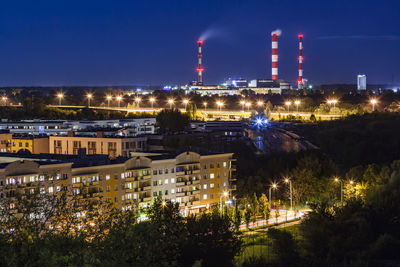 Aerial view of illuminated buildings in city at night