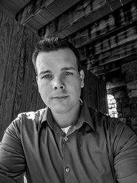 Portrait of young man standing outdoors