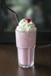 Close-up of ice cream in glass on table