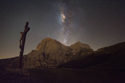 Scenic view of mountains against sky at night