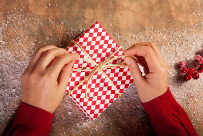 Close-up of hand holding christmas decoration