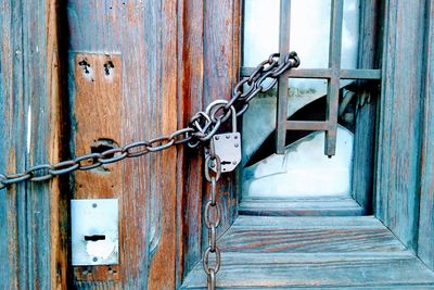 Broken door with padlock 