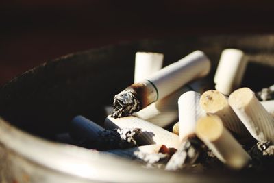 Close-up of cigarette smoking on table