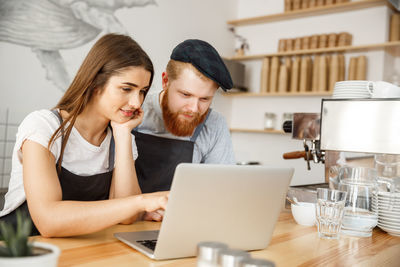 Young man using laptop on table