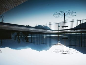 Ski lift against sky during winter