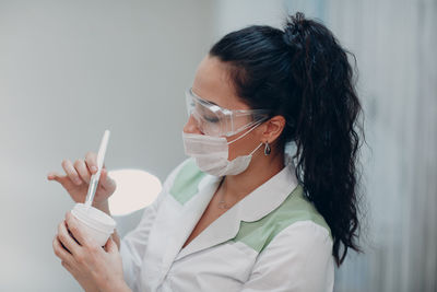 Portrait of woman holding ice cream