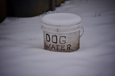 Dog water text on frozen bucket