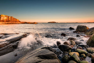 Scenic view of sea against sky during sunset