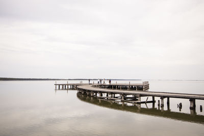 Pier over sea against sky