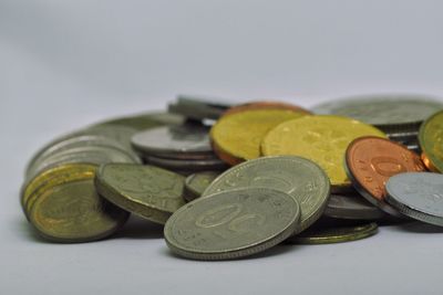 Close-up of coins on white background