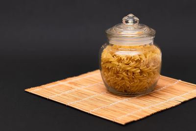 Close-up of cupcakes on table against black background