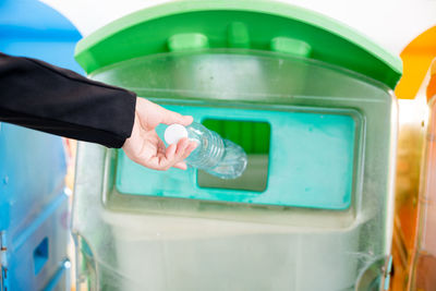 Cropped hand washing hands in sink