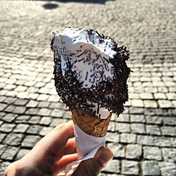 Midsection of person holding ice cream cone