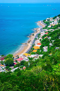 High angle view of buildings by sea