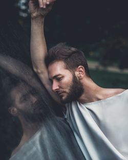 Portrait of young man looking up