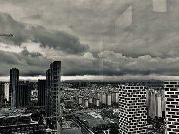 Modern buildings in city against sky