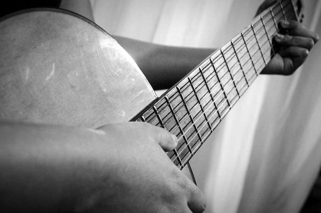 music, musical instrument, midsection, playing, men, adults only, guitar, women, people, adult, musical instrument string, close-up, human hand, plucking an instrument, indoors, human body part, musician, only men, one person, day