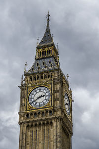 Low angle view of clock tower against sky