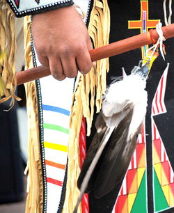 Native american indian tribal clothing displayed outdoors.