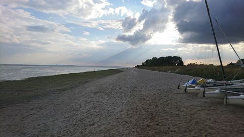 Scenic view of beach against sky during sunset