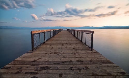 Pier over sea against sky