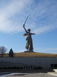 Low angle view of statue against cloudy sky