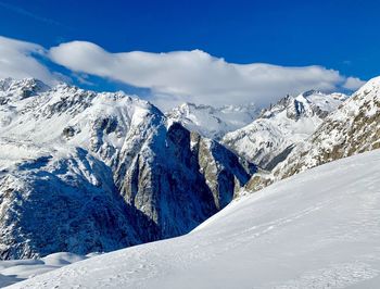 Snow covered mountains against sky