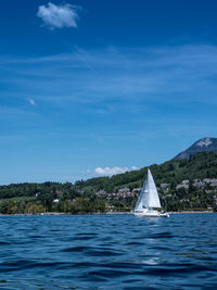 Scenic view of sea against blue sky