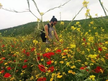 Woman working on field against sky