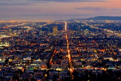 High angle view of illuminated buildings in city