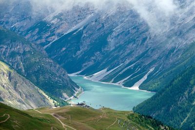 Scenic view of river amidst mountains