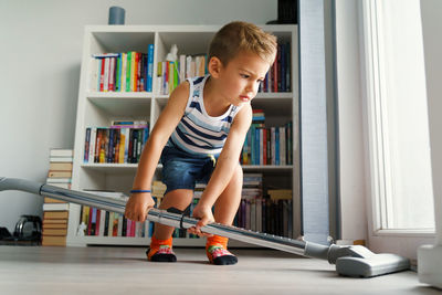 Full length of boy playing at home