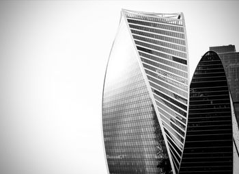 Low angle view of modern buildings against clear sky