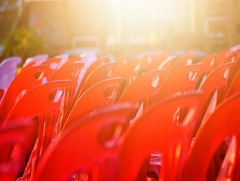 Close-up of red chairs against blurred background