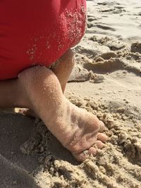 Low section of person on beach