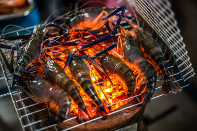 High angle view of meat on barbecue grill