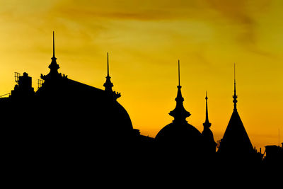 Silhouette temple against sky during sunset