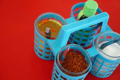 Close-up of multi colored candies against red background