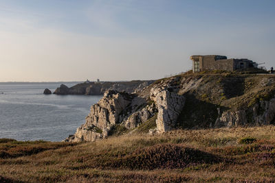 Panoramic view of sea and buildings against sky