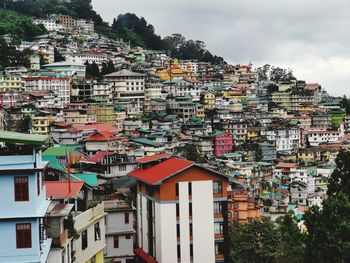 Houses in town against sky