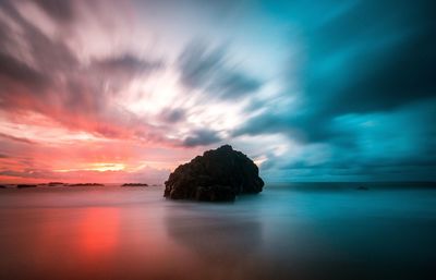 Scenic view of sea against sky at sunset