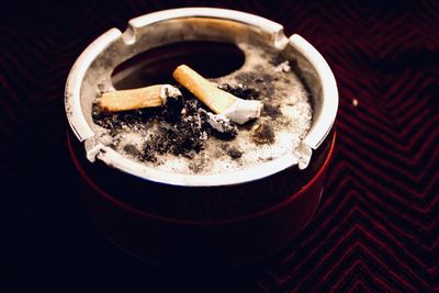 High angle view of cigarette  in ashtray 