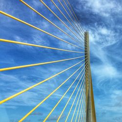 Low angle view of bridge against blue sky