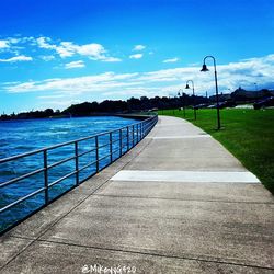 View of empty pier against cloudy sky